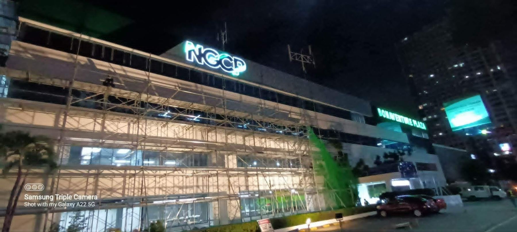 NCCP building with an illuminated high-rise sign at night